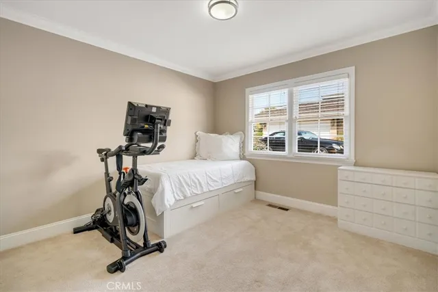 a bedroom with furniture and a window