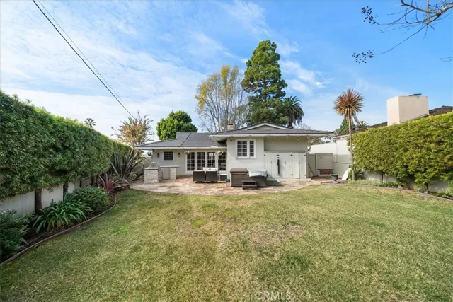 a front view of a house with yard porch and furniture