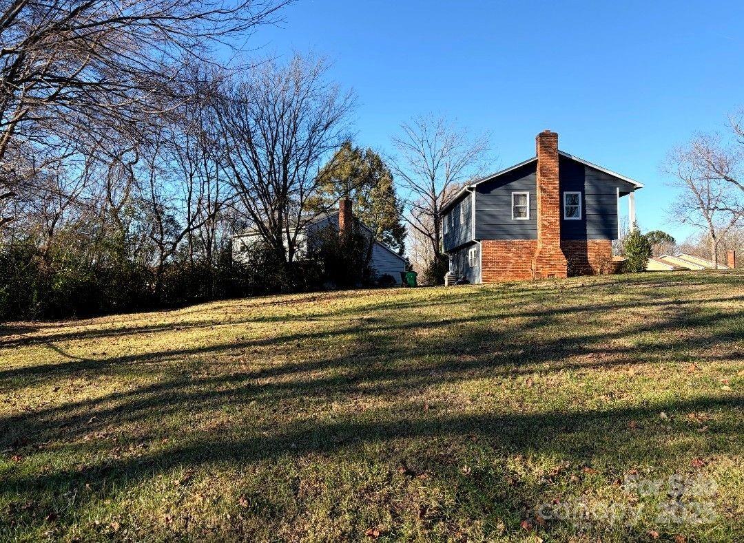 5601 Beaconsfield Road, Unit 30 Charlotte, NC 28214 - Photo 2 of 15 a front view of a house with a yard