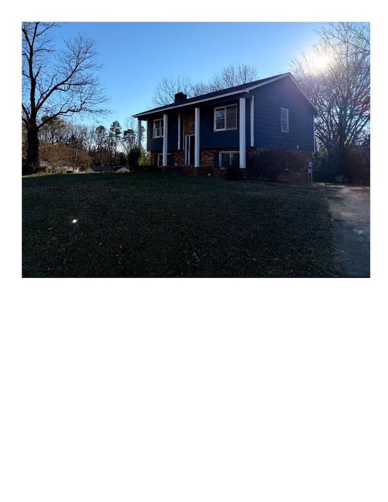 5601 Beaconsfield Road, Unit 30 Charlotte, NC 28214 - Photo 3 of 15 a view of a house with a yard