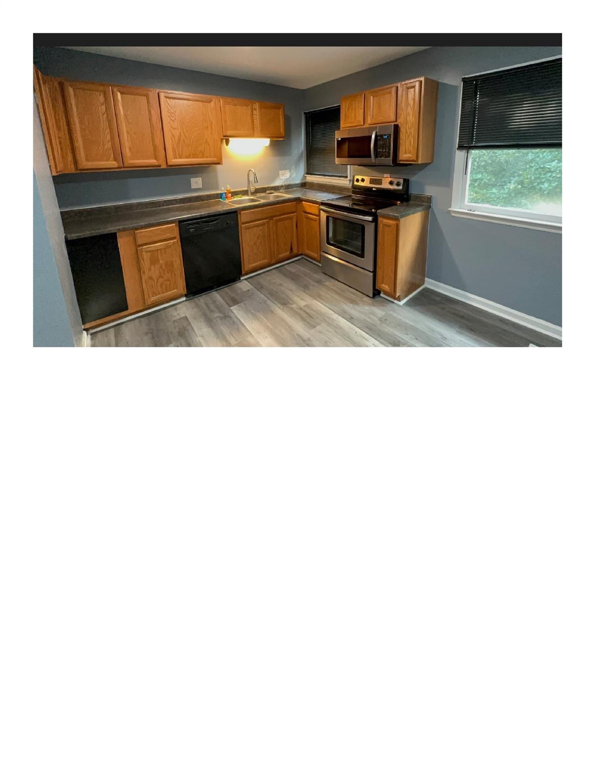 5601 Beaconsfield Road, Unit 30 Charlotte, NC 28214 - Photo 9 of 15 a kitchen with stainless steel appliances a stove and a microwave