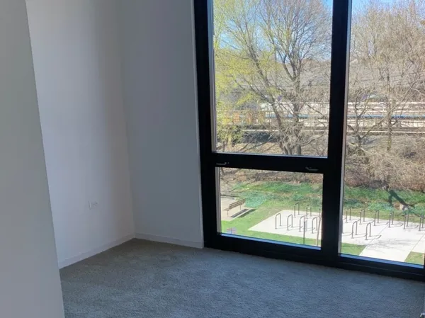 a view of a room with a large window