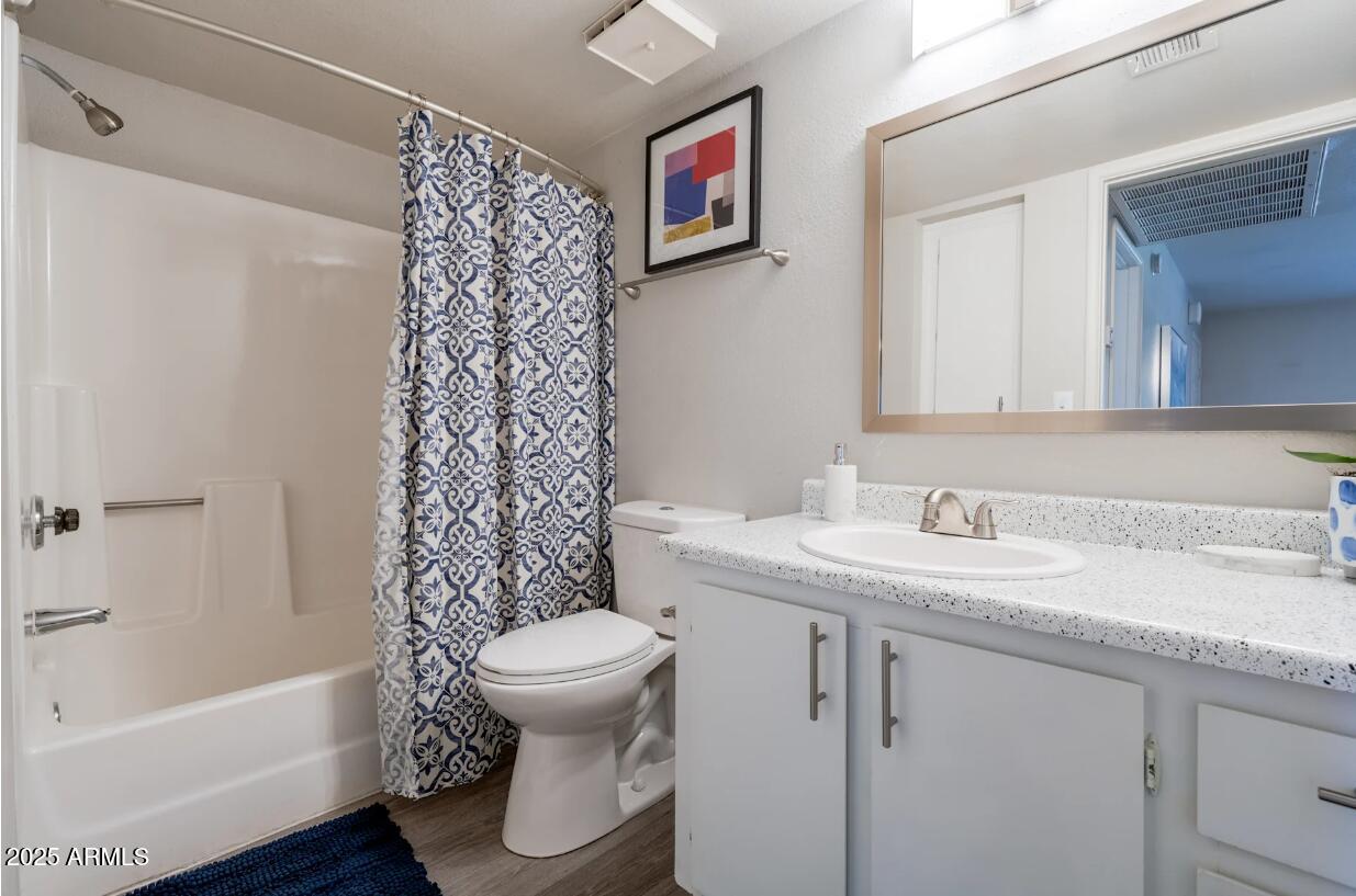 2311 East Union Hills Drive, Unit 22 Phoenix, AZ 85024 - Photo 7 of 12 a bathroom with a sink toilet and shower
