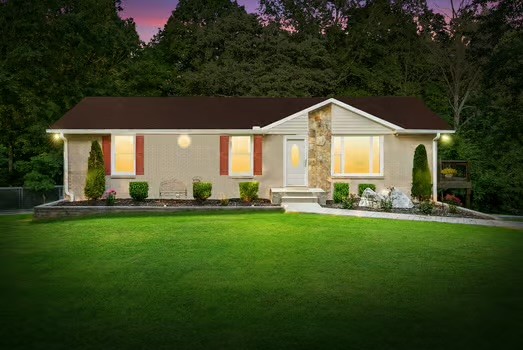 a front view of house with yard and green space