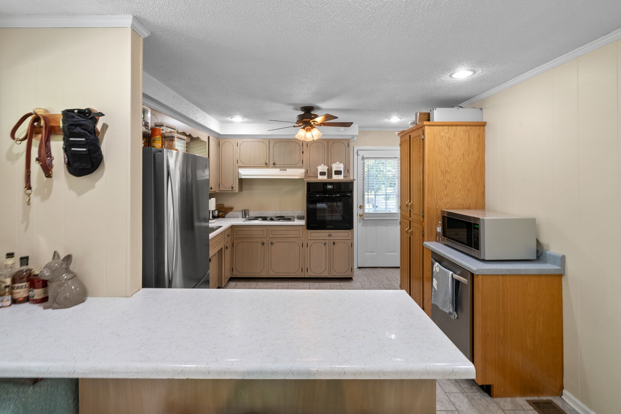 1001 Issac Clifton Road Chapmansboro, TN 37035 - Photo 13 of 47 a kitchen with stainless steel appliances kitchen island a refrigerator sink and stove