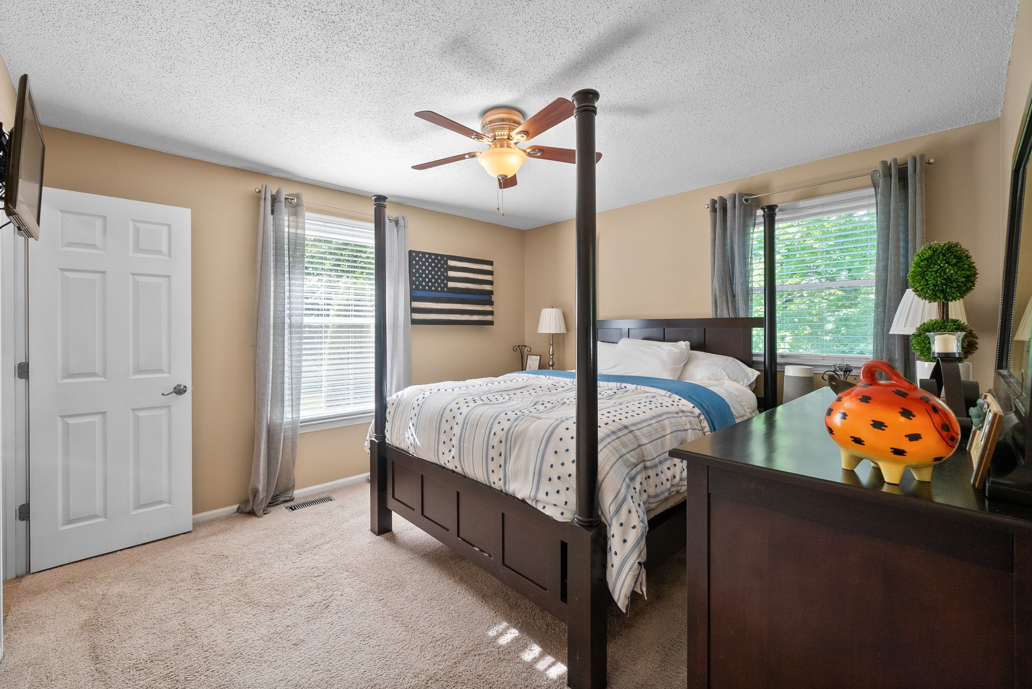 1001 Issac Clifton Road Chapmansboro, TN 37035 - Photo 16 of 47 a bed sitting in a bedroom next to a window