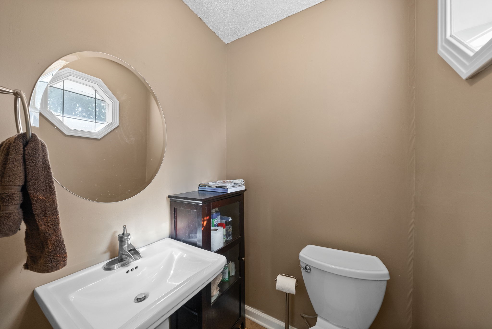 1001 Issac Clifton Road Chapmansboro, TN 37035 - Photo 18 of 47 a bathroom with a toilet a sink and mirror