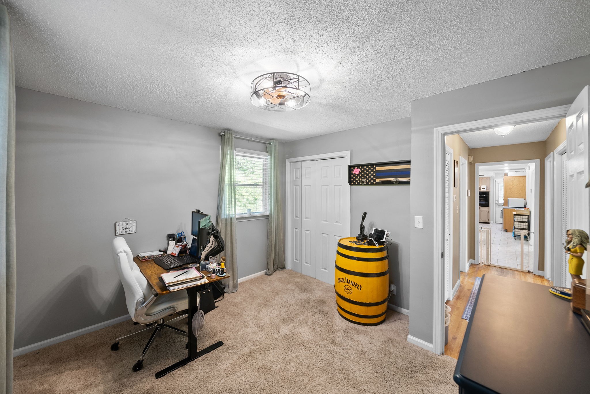 1001 Issac Clifton Road Chapmansboro, TN 37035 - Photo 20 of 47 a bedroom with a bed and a chandelier