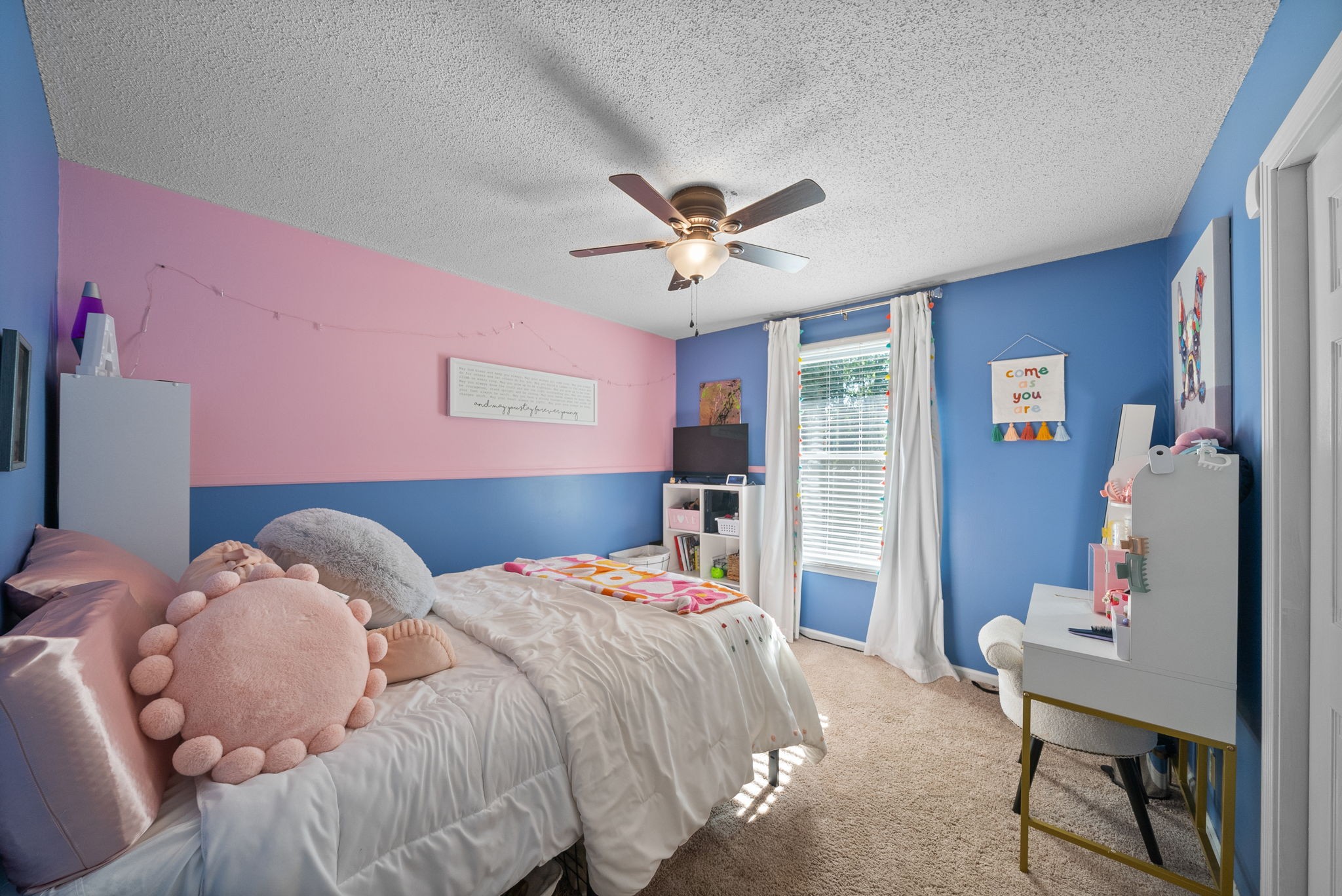 1001 Issac Clifton Road Chapmansboro, TN 37035 - Photo 23 of 47 a bedroom with a bed and a chandelier