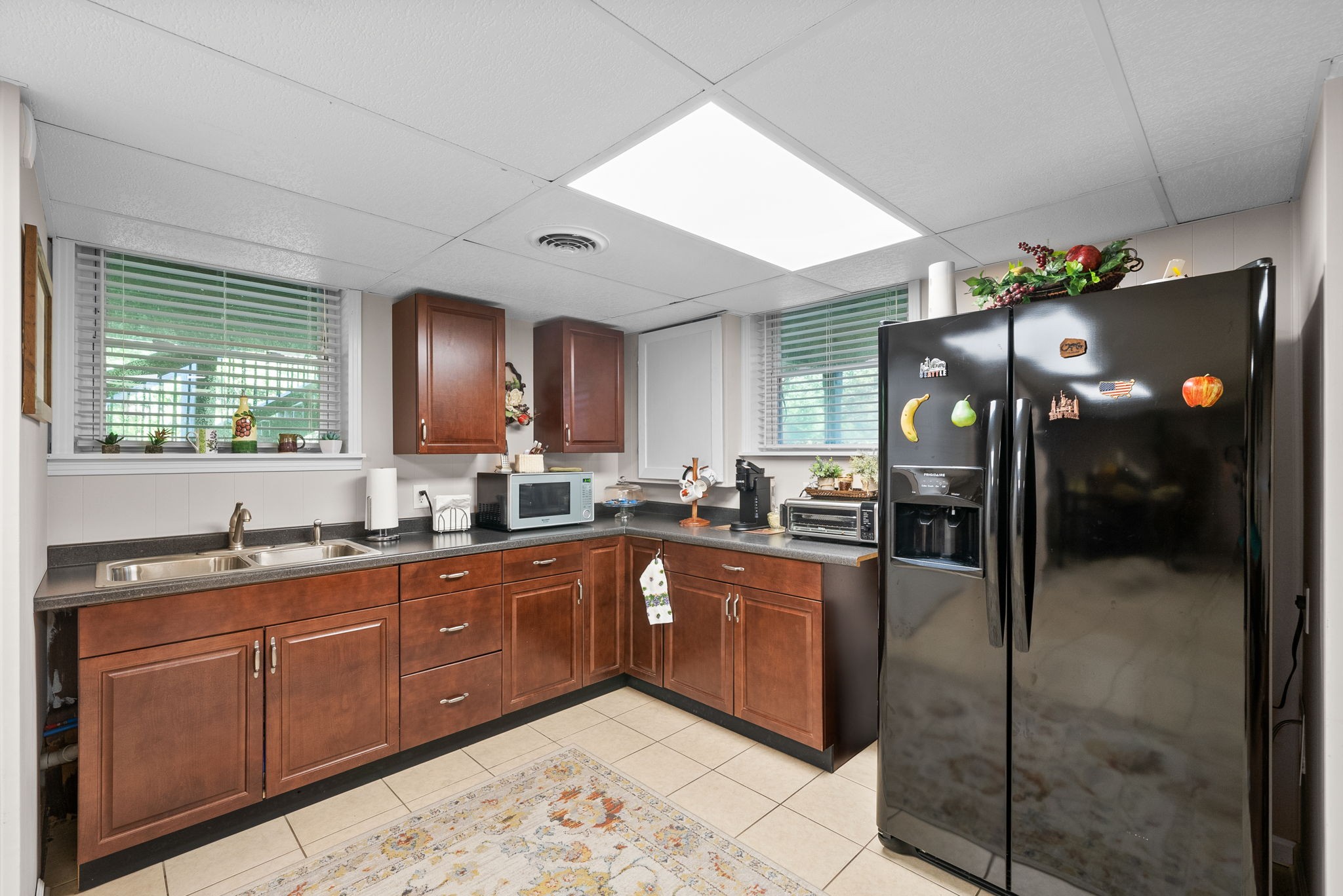 1001 Issac Clifton Road Chapmansboro, TN 37035 - Photo 28 of 47 a large kitchen with cabinets and wooden floor