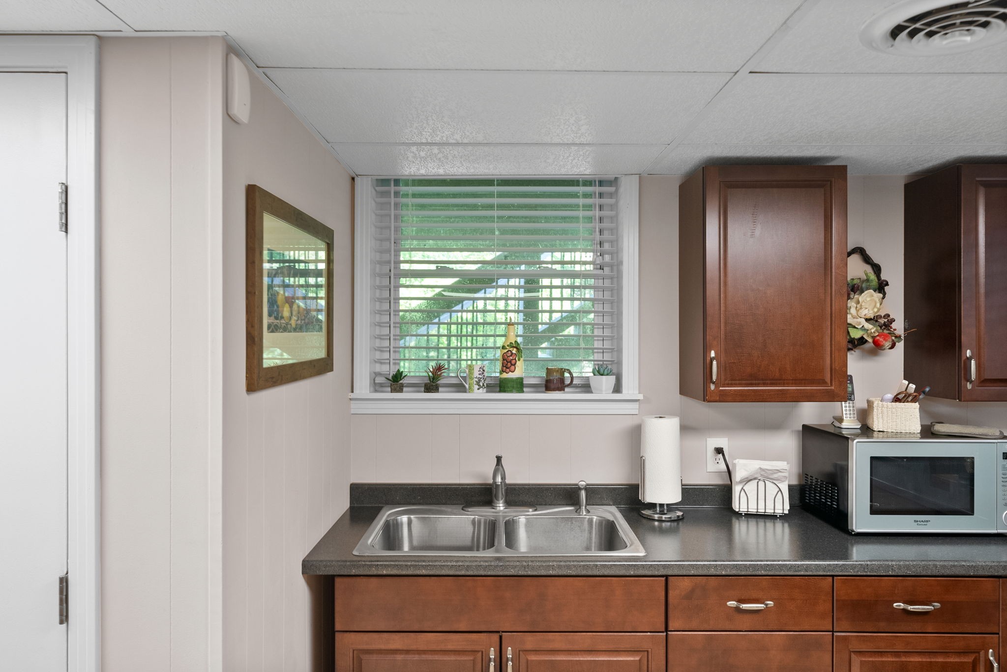 1001 Issac Clifton Road Chapmansboro, TN 37035 - Photo 29 of 47 a kitchen with a sink and a window