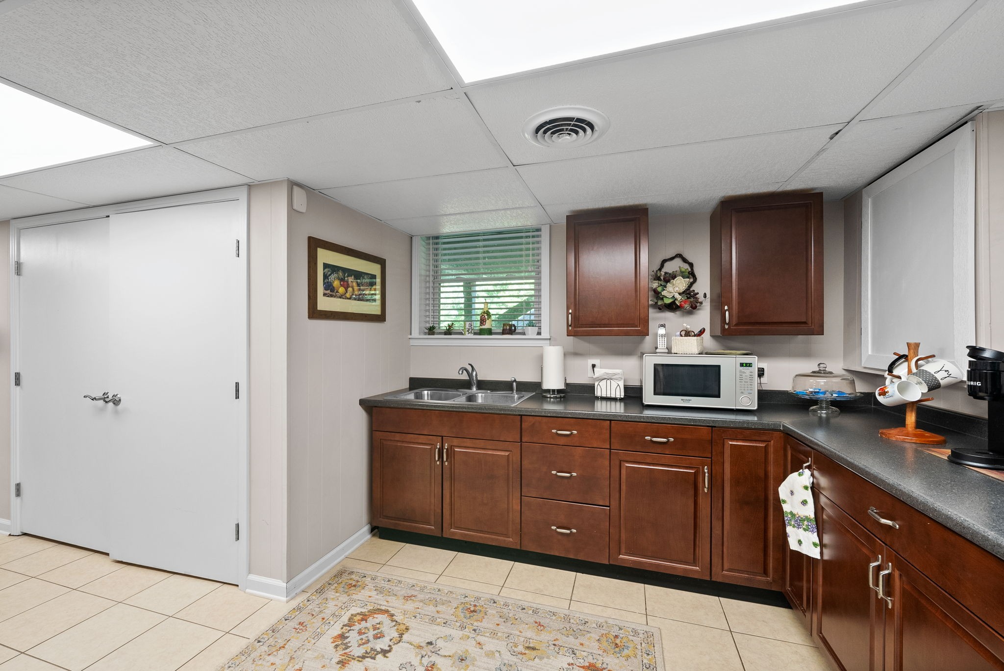 1001 Issac Clifton Road Chapmansboro, TN 37035 - Photo 30 of 47 a kitchen with stainless steel appliances granite countertop a sink and cabinets