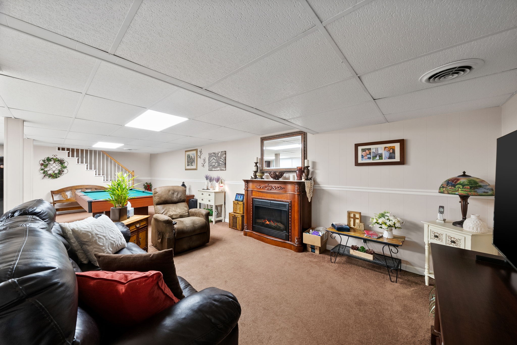 1001 Issac Clifton Road Chapmansboro, TN 37035 - Photo 35 of 47 a living room with furniture and a flat screen tv