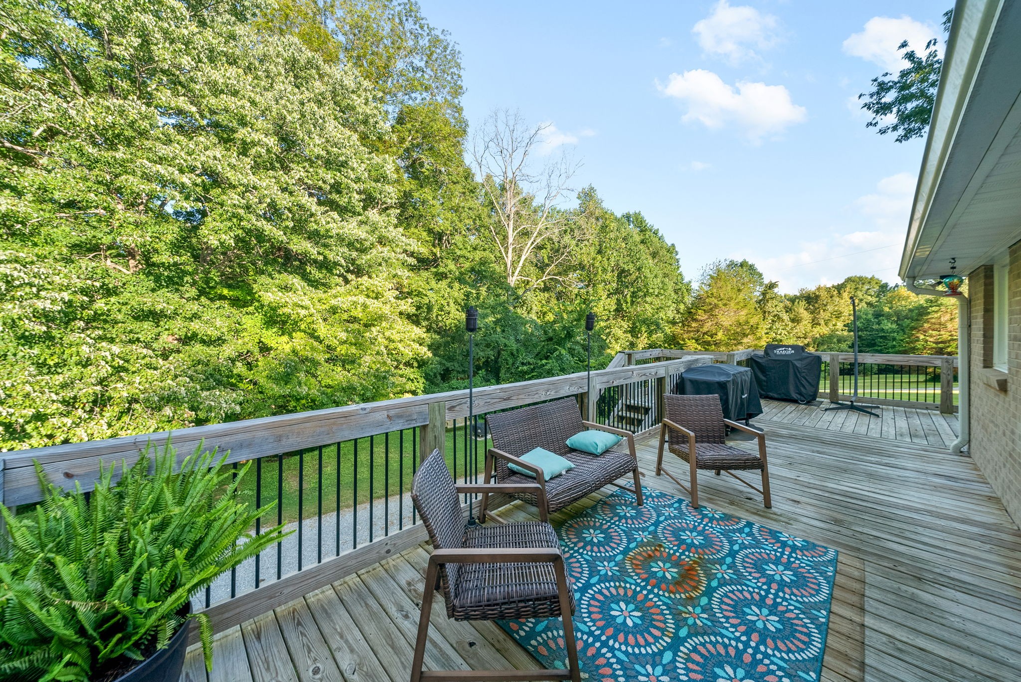 1001 Issac Clifton Road Chapmansboro, TN 37035 - Photo 41 of 47 a balcony with wooden floor and outdoor seating