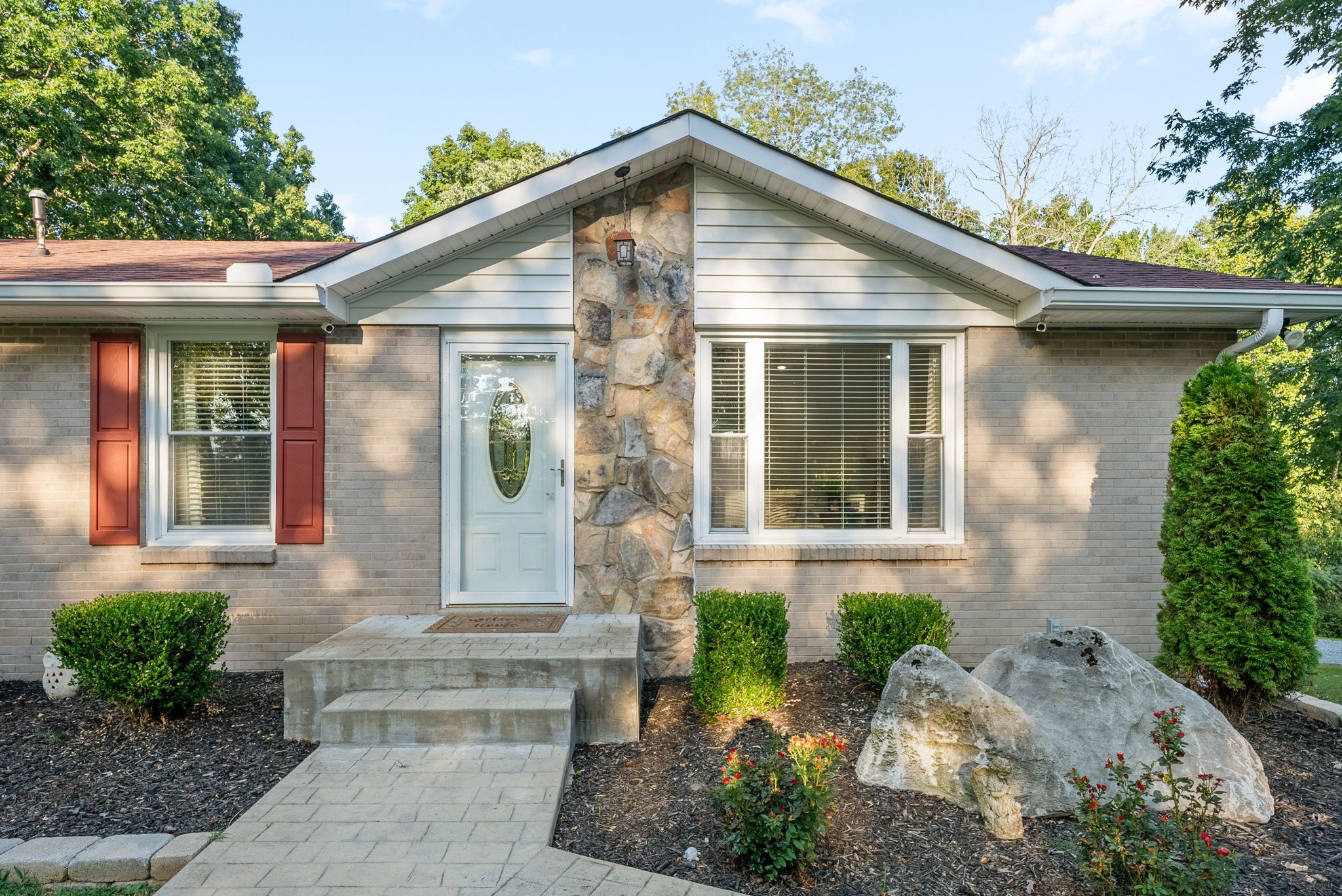 1001 Issac Clifton Road Chapmansboro, TN 37035 - Photo 5 of 47 a front view of a house with garden