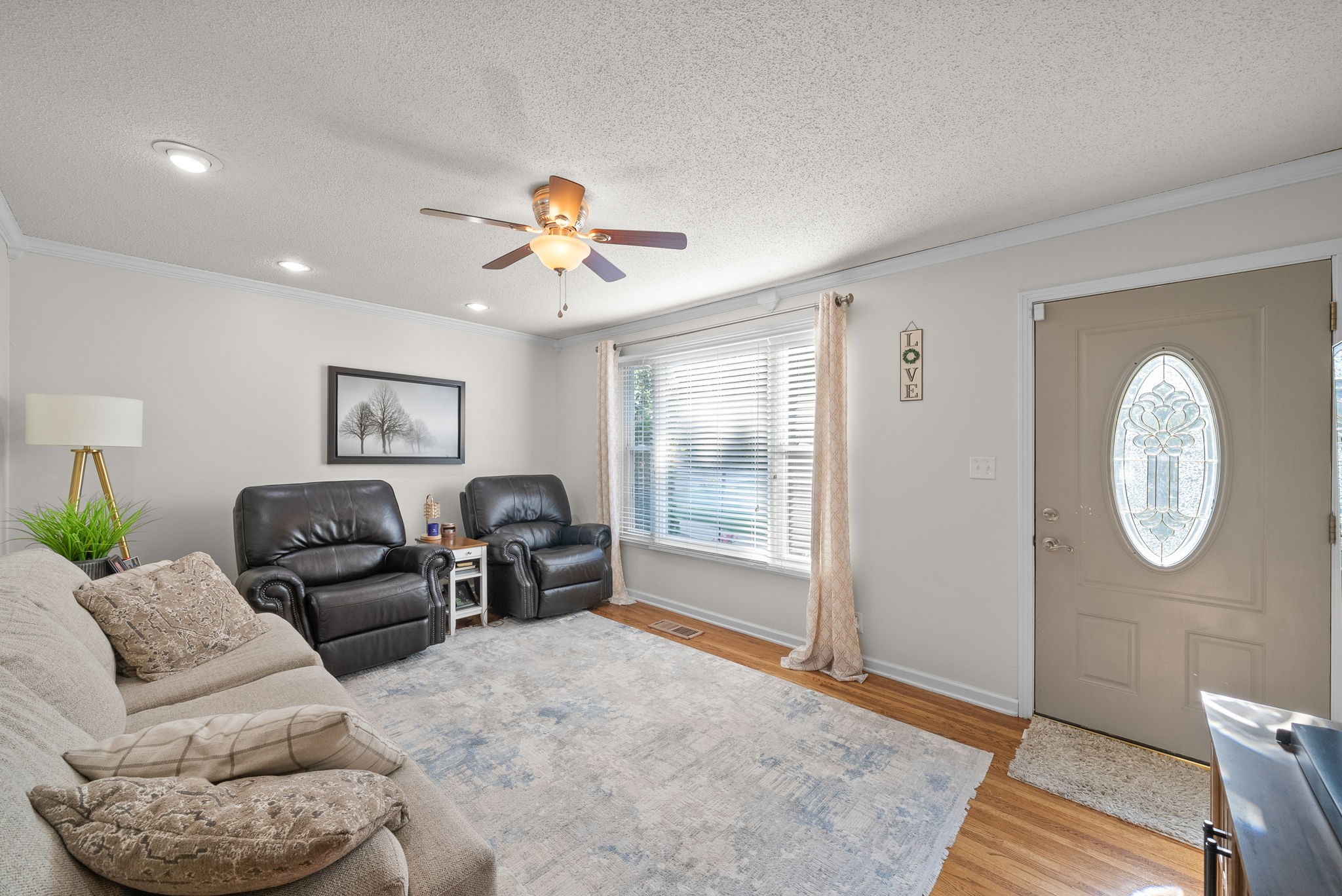 1001 Issac Clifton Road Chapmansboro, TN 37035 - Photo 8 of 47 a living room with furniture a chandelier and a window