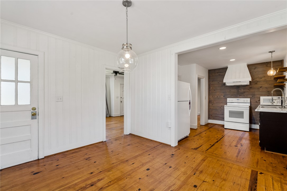 419 Whitehall Road Anderson, SC 29625 - Photo 6 of 28 Hearty wood floors unite a welcoming entry with a well-appointed kitchen, ideal for effortless daily living.