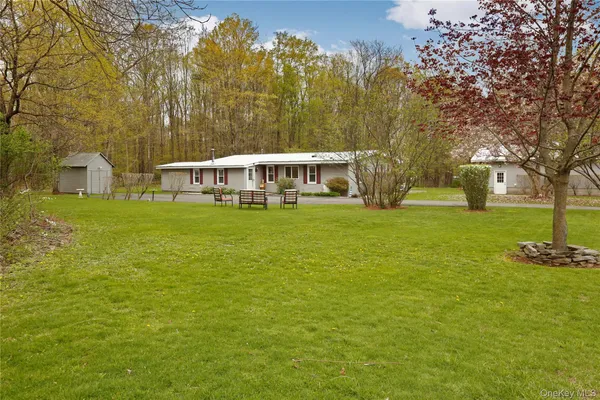 a view of a house with a big yard