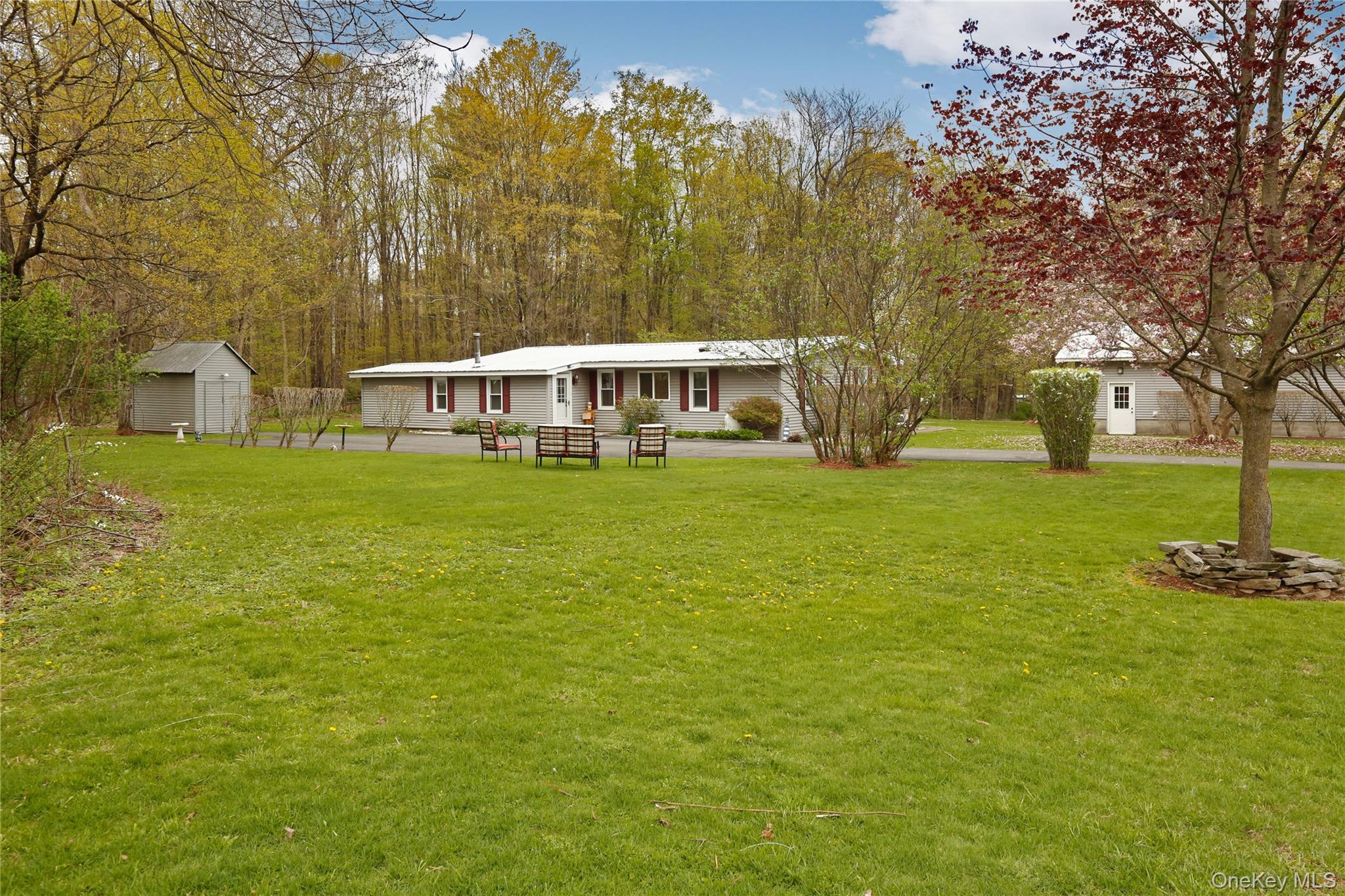 a view of a house with a big yard