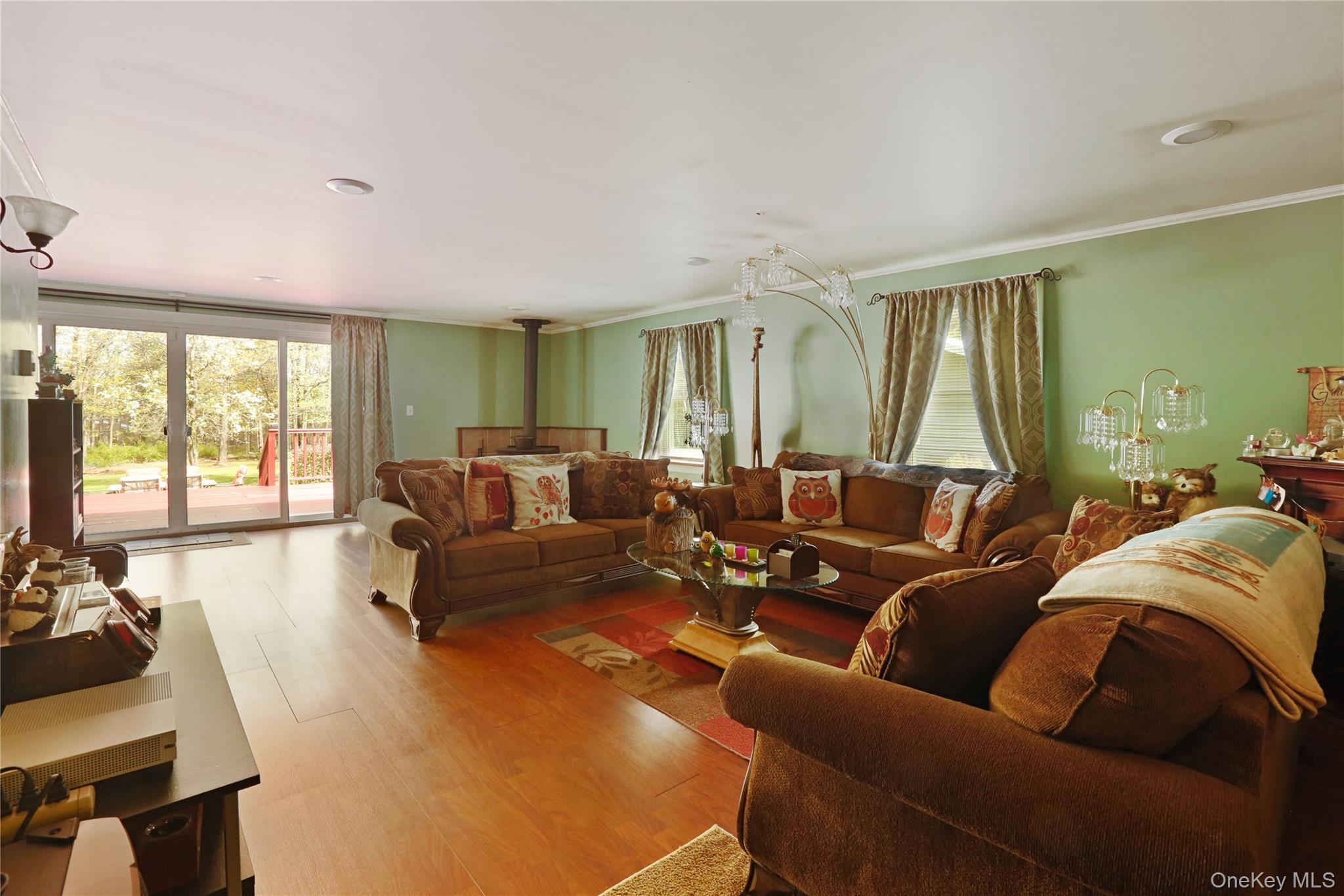 650 Granite Road Kerhonkson, NY 12446 - Photo 18 of 38 a living room with furniture and a large window