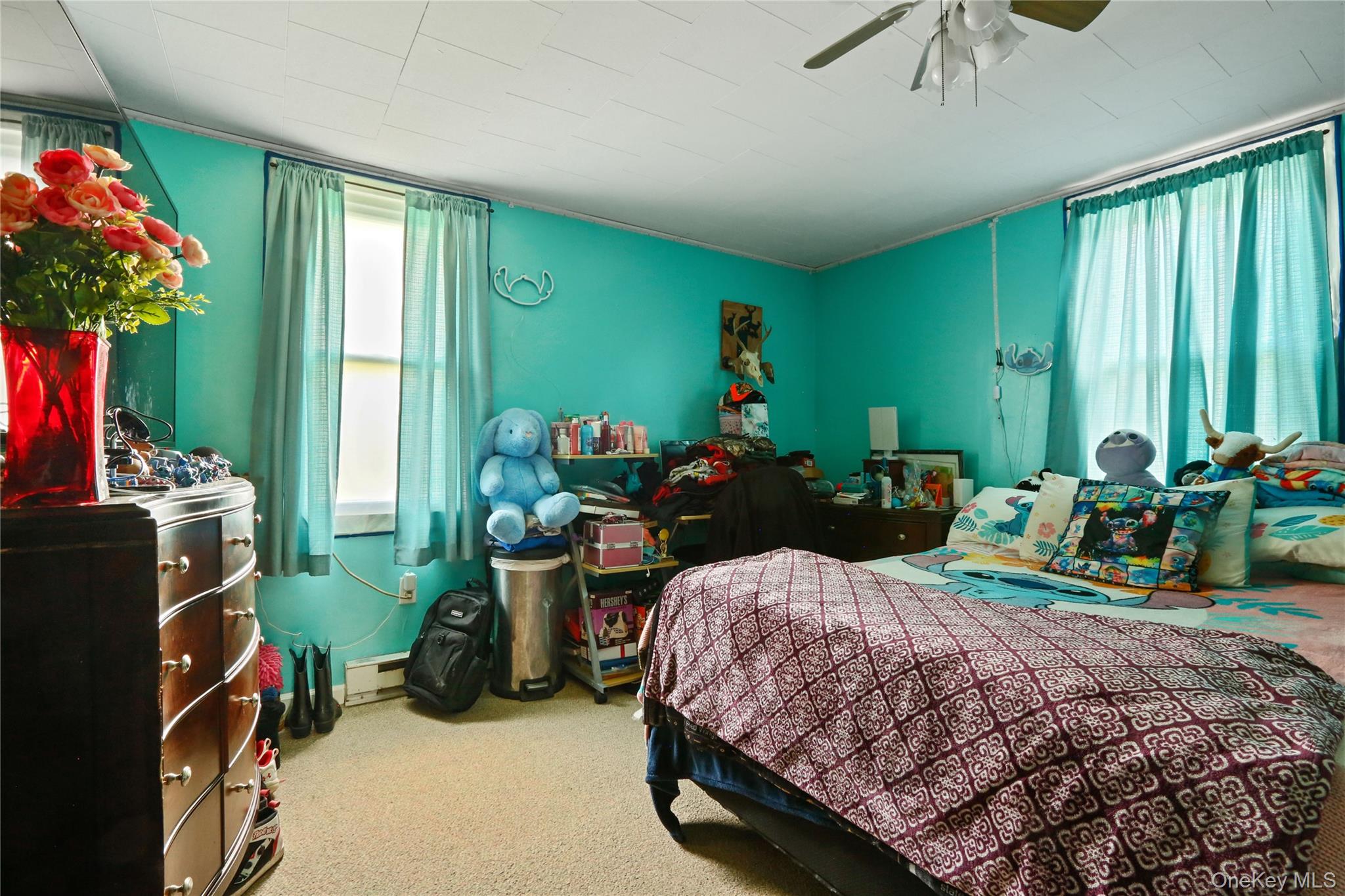 650 Granite Road Kerhonkson, NY 12446 - Photo 20 of 38 a bedroom with a bed a large window and potted plants