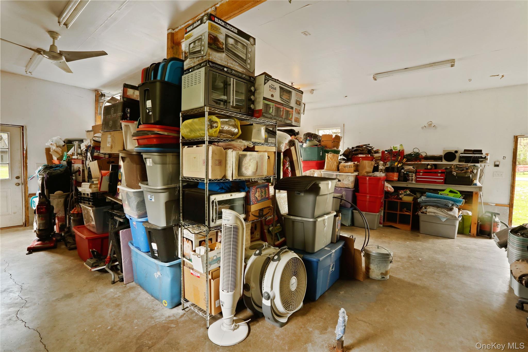 650 Granite Road Kerhonkson, NY 12446 - Photo 30 of 38 a view of a storage room with rack and chairs