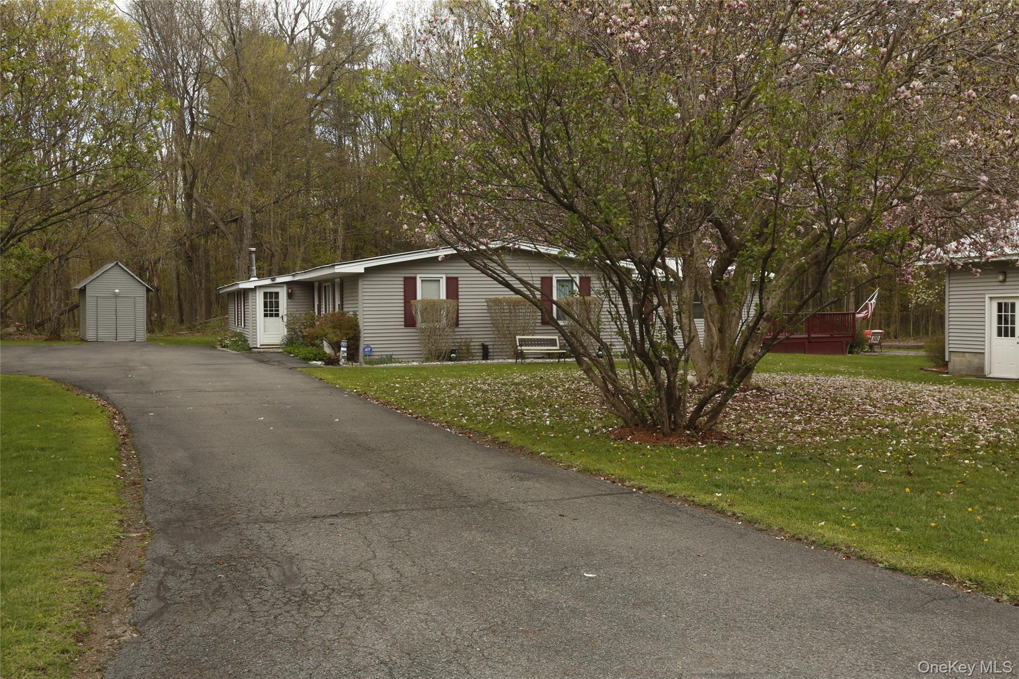 650 Granite Road Kerhonkson, NY 12446 - Photo 35 of 38 a front view of a house with a yard and garage