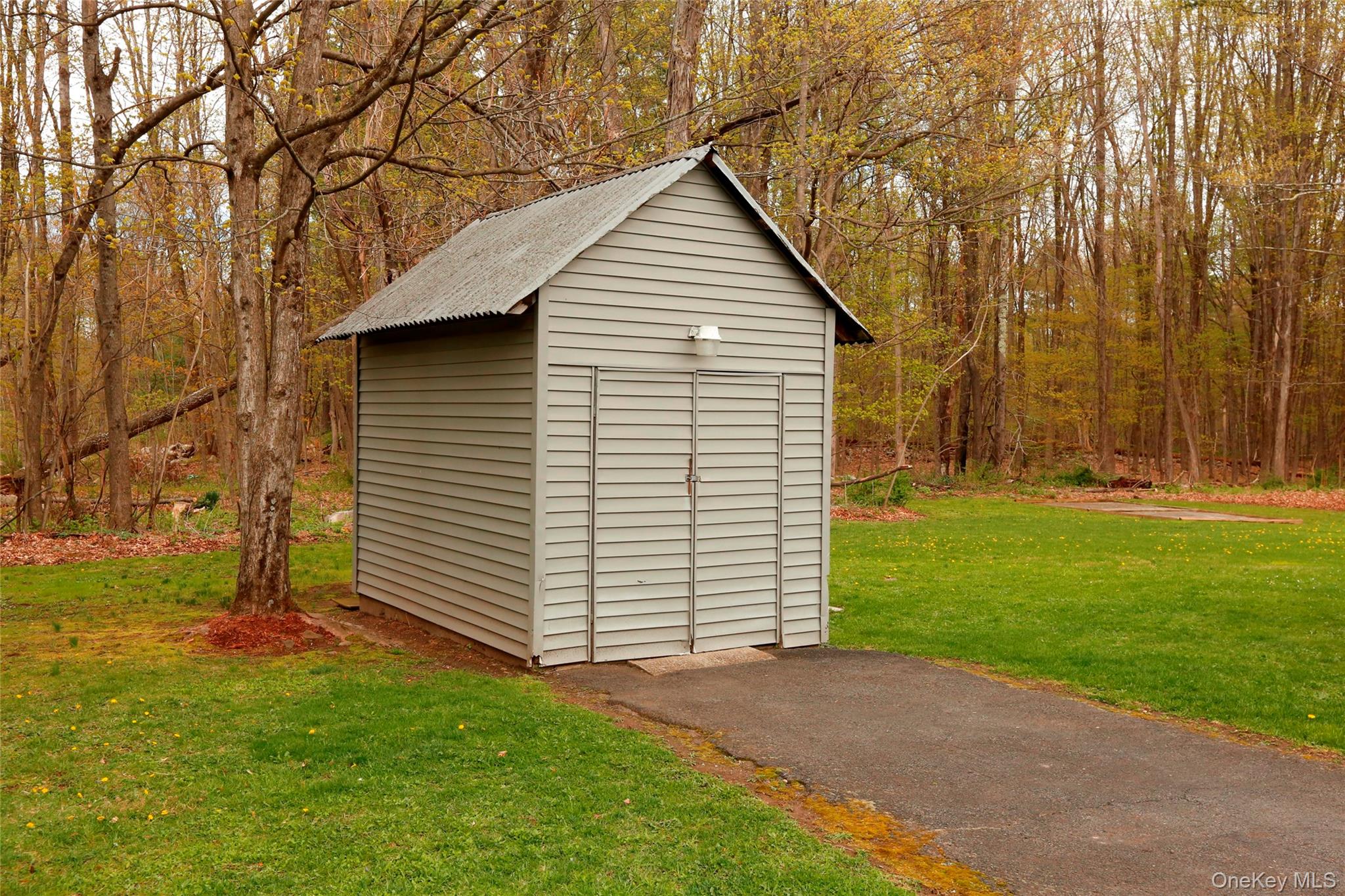 650 Granite Road Kerhonkson, NY 12446 - Photo 36 of 38 a view of backyard with a garden and entertaining space