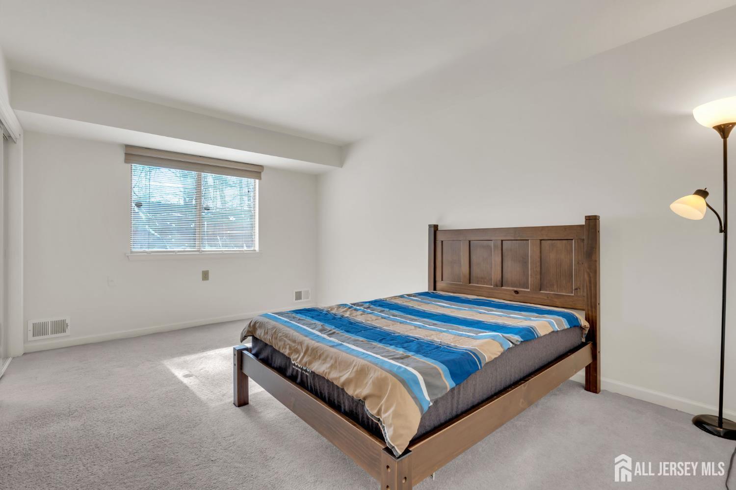 603 Jacob Court Dayton, NJ 08810 - Photo 16 of 18 a bedroom with a bed and window