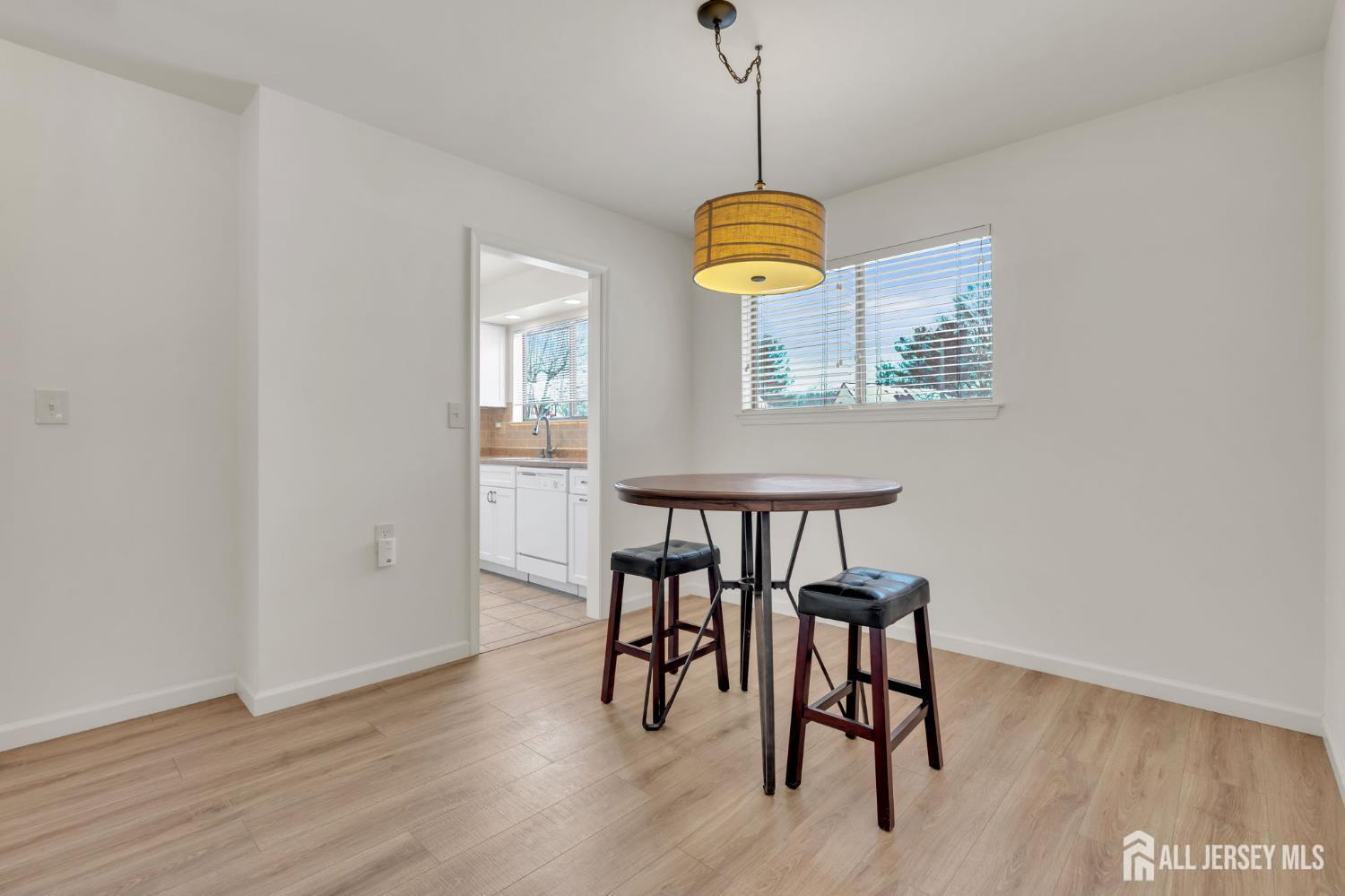 603 Jacob Court Dayton, NJ 08810 - Photo 3 of 18 a view of a dining room with furniture wooden floor and chandelier