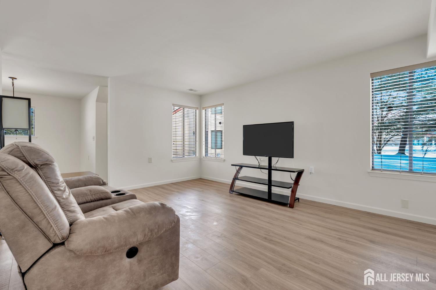 603 Jacob Court Dayton, NJ 08810 - Photo 10 of 18 a living room with furniture and a flat screen tv