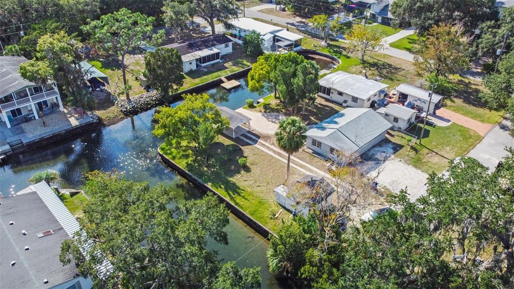 Teal Drive Weeki Wachee, FL 34607 - Photo 12 of 18 an aerial view of residential house with outdoor space and trees all around