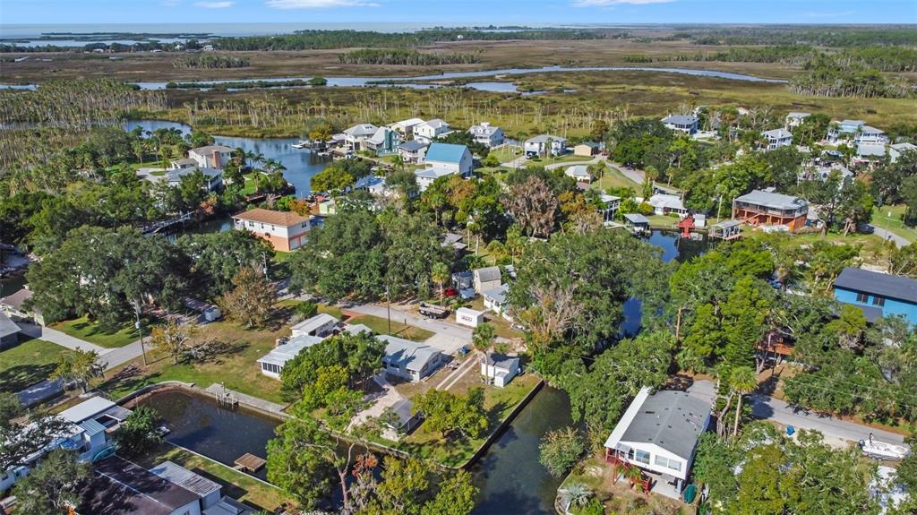 Teal Drive Weeki Wachee, FL 34607 - Photo 13 of 18 an aerial view of residential houses with outdoor space and lake view