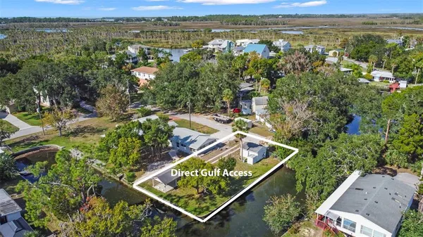 a view of swimming pool with a yard and ocean view