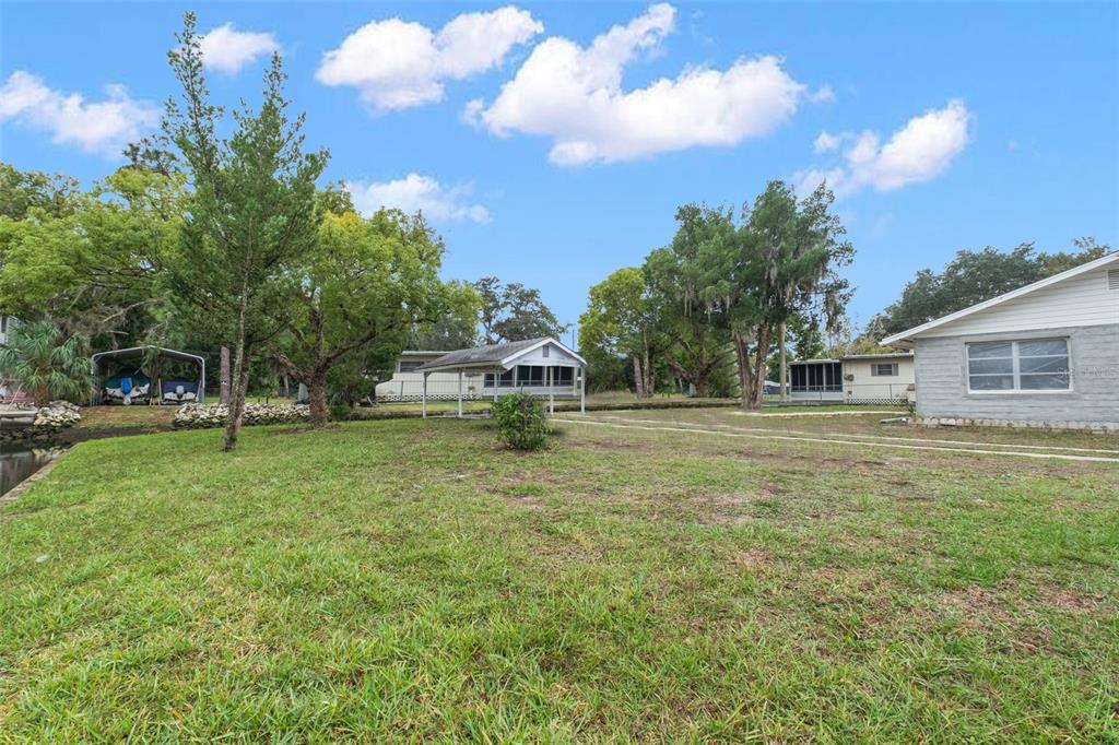 Teal Drive Weeki Wachee, FL 34607 - Photo 7 of 18 a house view with a garden space
