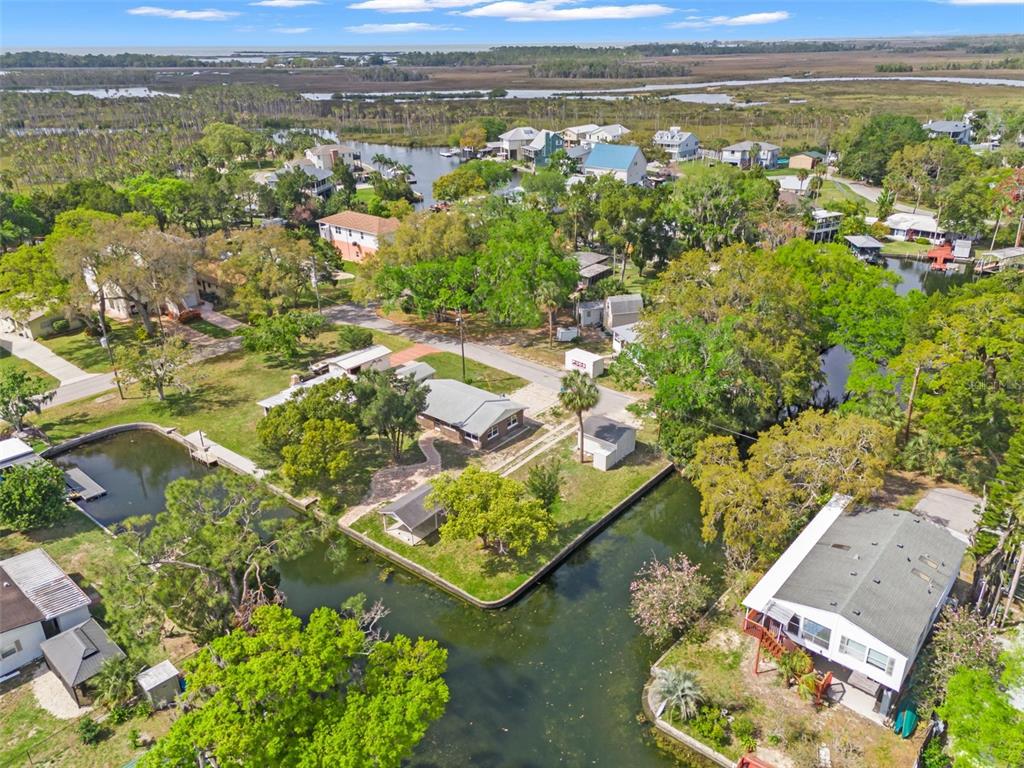 Teal Drive Weeki Wachee, FL 34607 - Photo 10 of 18 an aerial view of residential houses with outdoor space