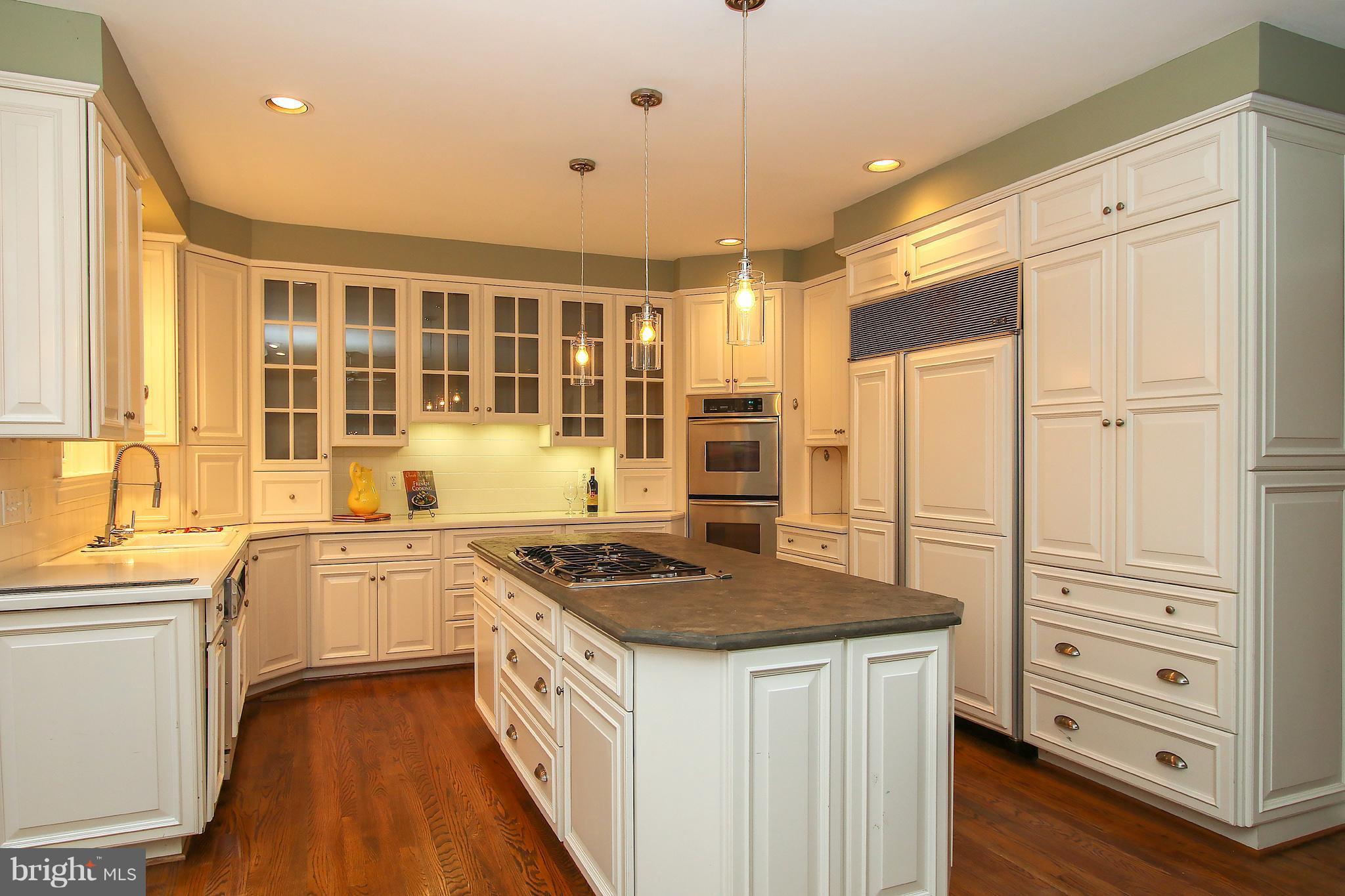 7900 Quarry Ridge Way Bethesda, MD 20817 - Photo 12 of 30 a kitchen with stainless steel appliances granite countertop a stove and a refrigerator
