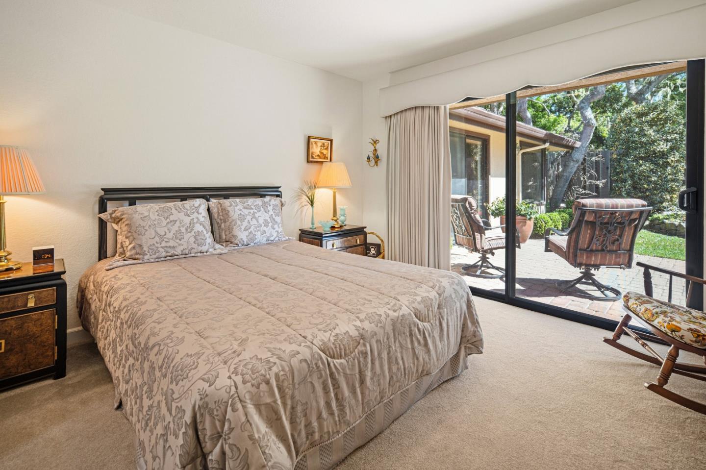 2911 Colton Road Pebble Beach, CA 93953 - Photo 37 of 46 a bed room with a bed and a chair