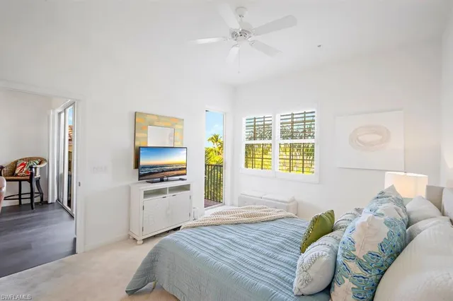 a bedroom with a bed and a television