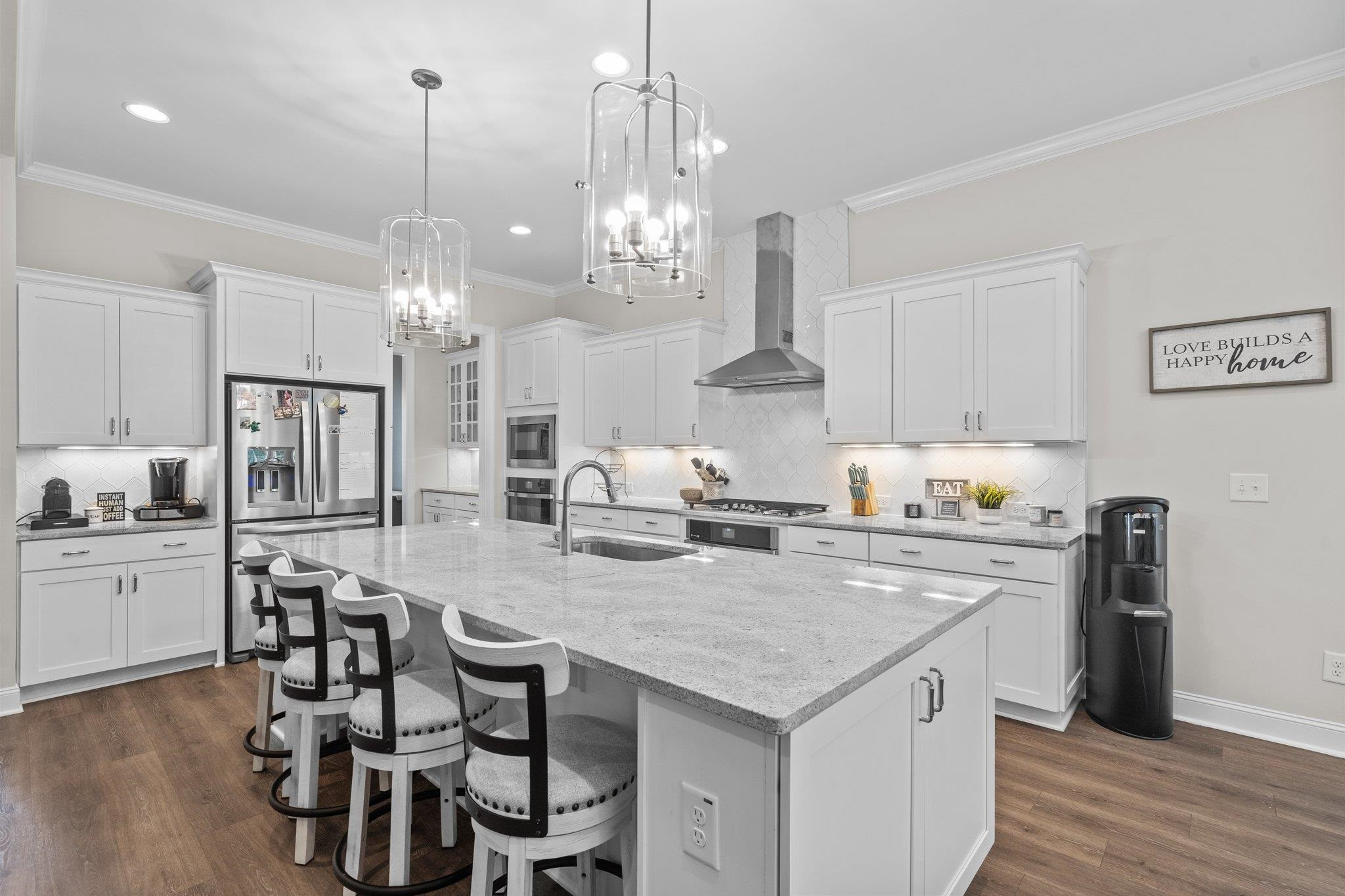 116 Brandy Mill Pittsboro, NC 27312 - Photo 14 of 47 a kitchen with a dining table chairs stainless steel appliances and cabinets