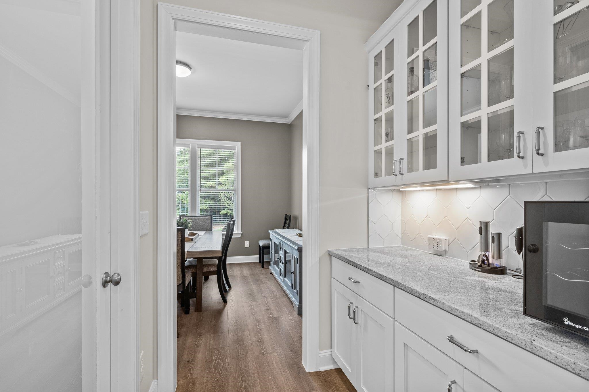116 Brandy Mill Pittsboro, NC 27312 - Photo 18 of 47 a kitchen with sink cabinets and wooden floor