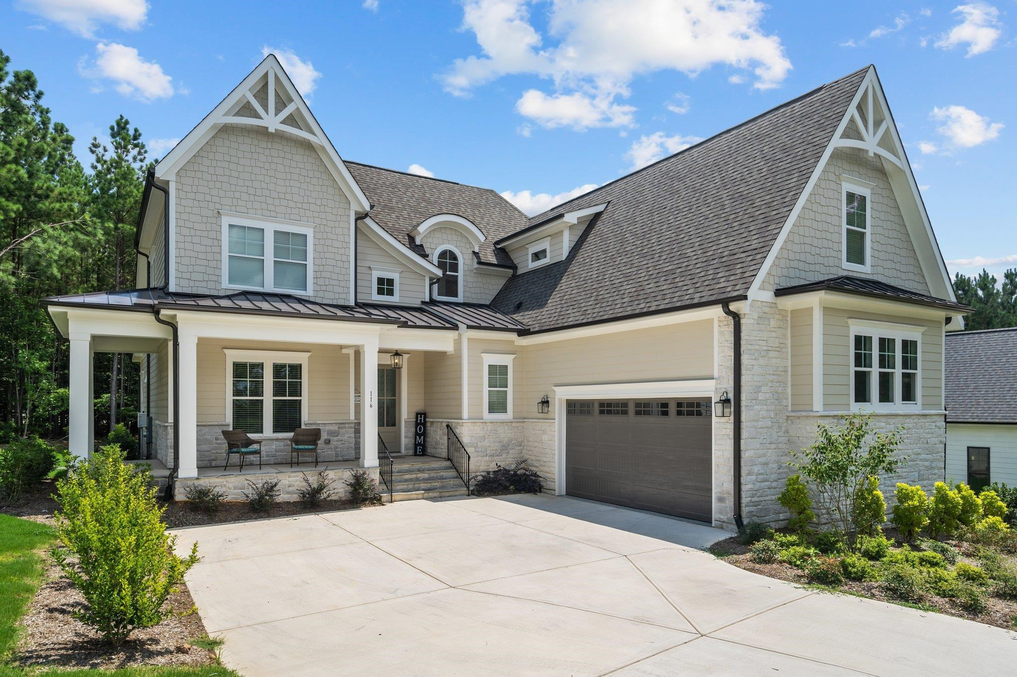 116 Brandy Mill Pittsboro, NC 27312 - Photo 2 of 47 a front view of a house with a yard and garage
