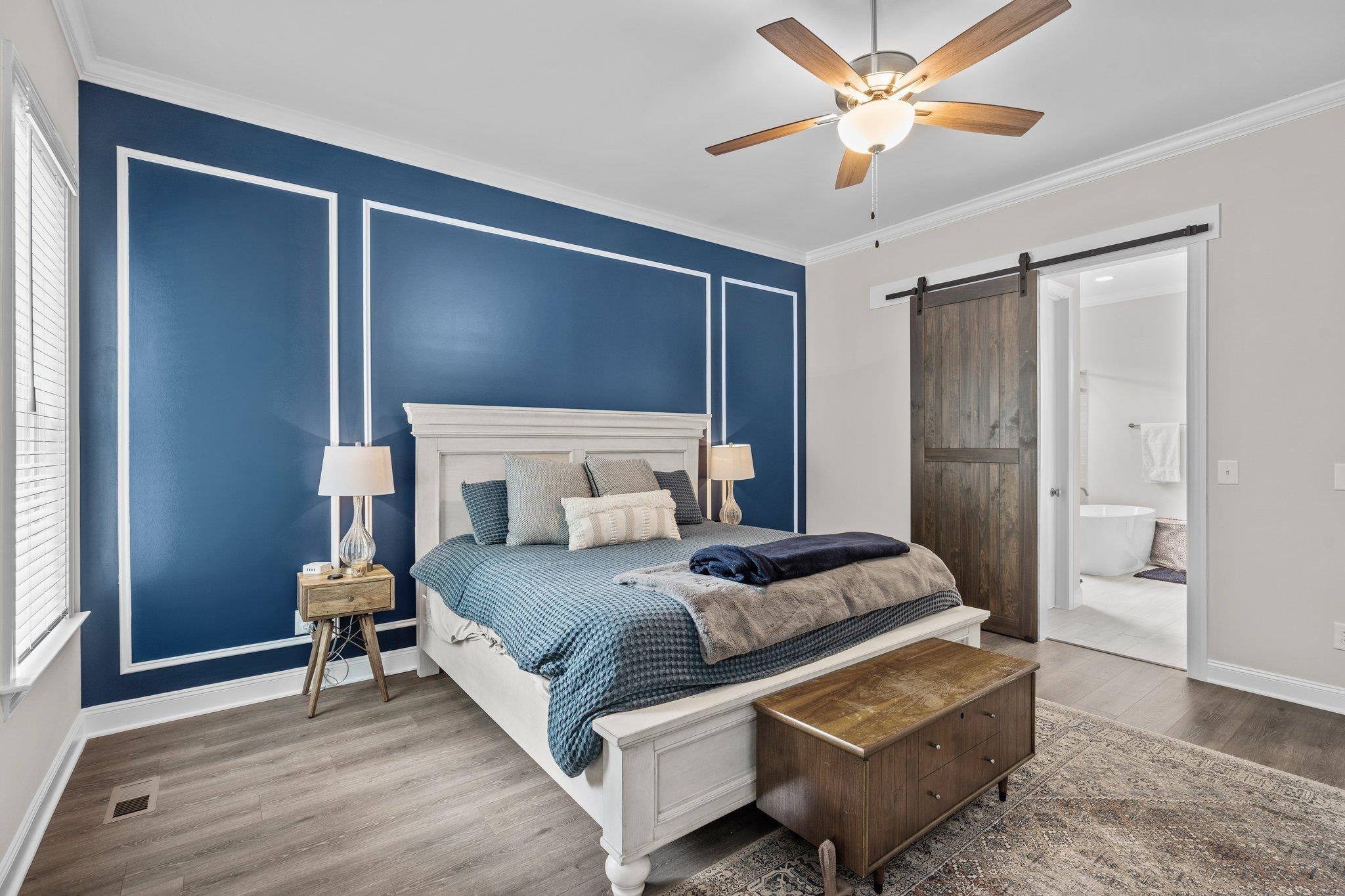 116 Brandy Mill Pittsboro, NC 27312 - Photo 21 of 47 a bedroom with a bed and a chandelier