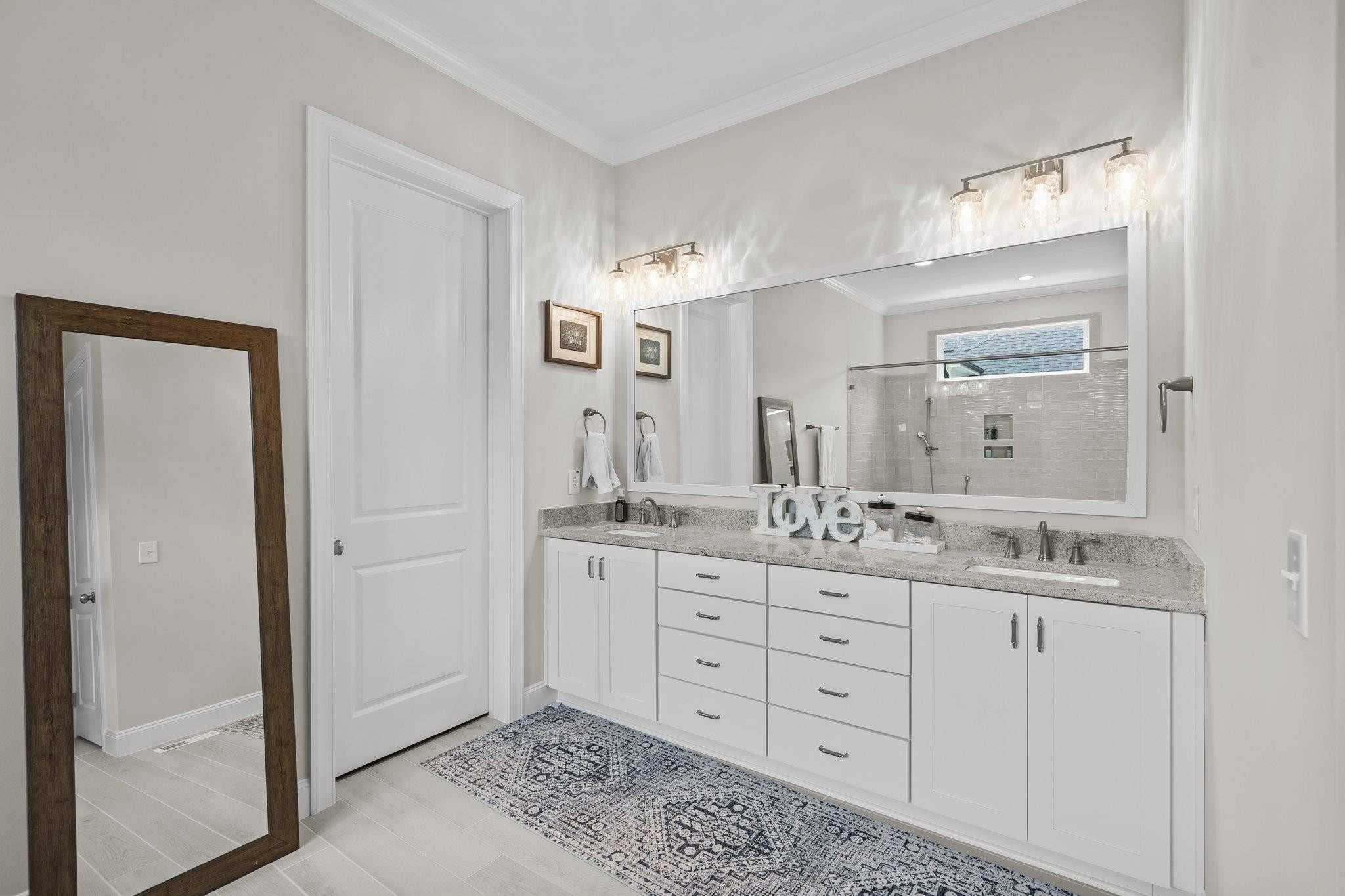 116 Brandy Mill Pittsboro, NC 27312 - Photo 23 of 47 a bathroom with double sink and a mirror