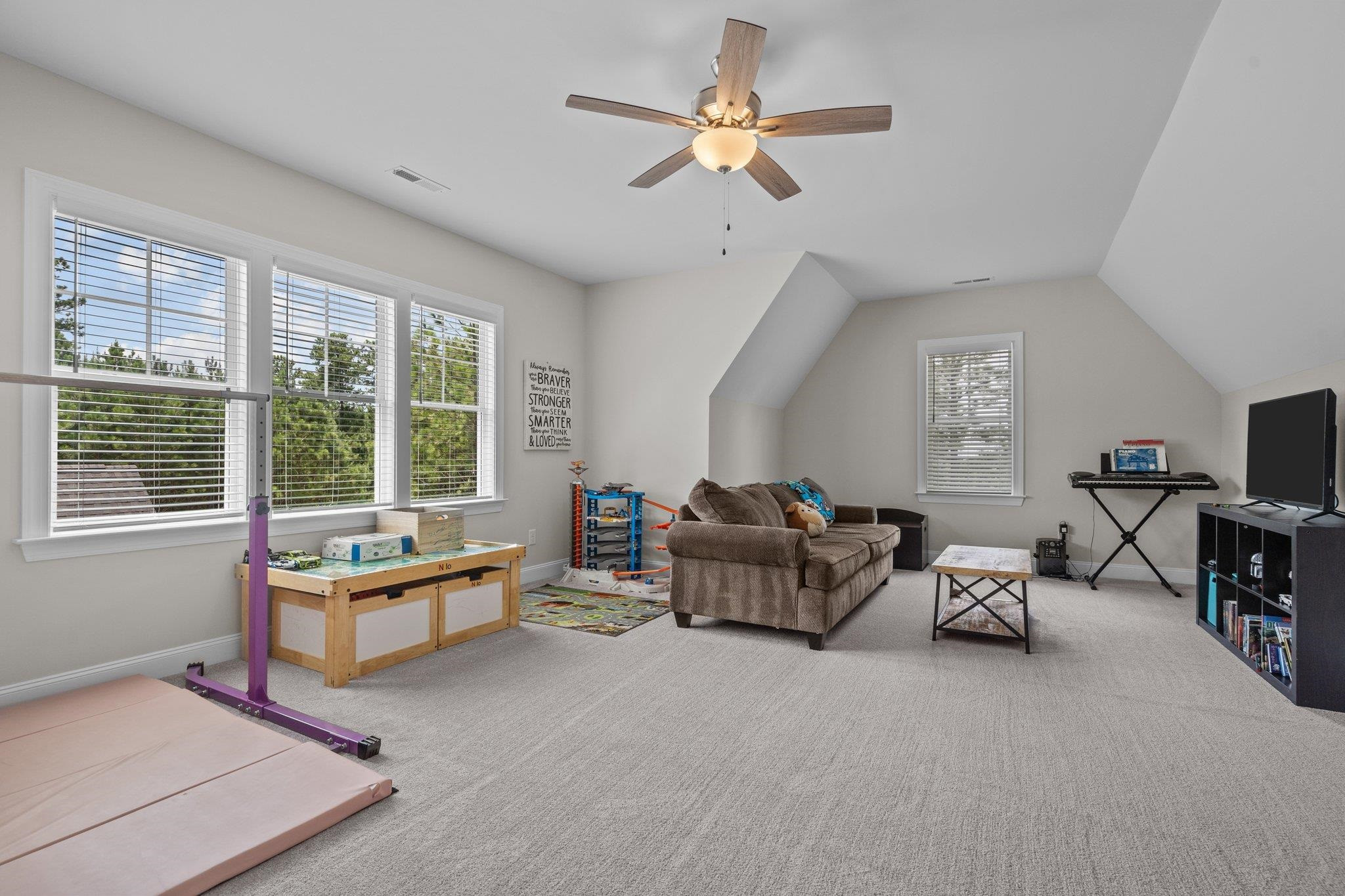 116 Brandy Mill Pittsboro, NC 27312 - Photo 29 of 47 a living room with furniture gym equipment and a large window