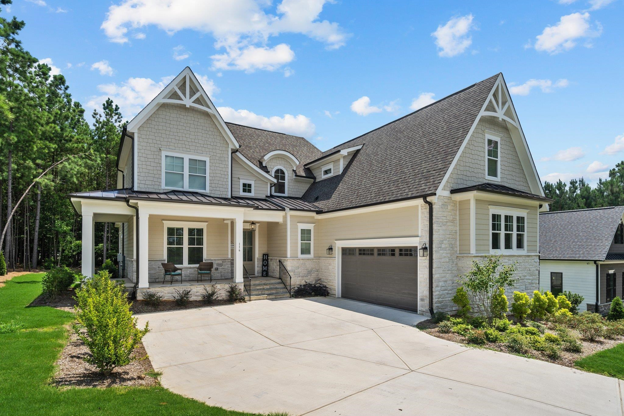 116 Brandy Mill Pittsboro, NC 27312 - Photo 3 of 47 a front view of a house with a yard and garage