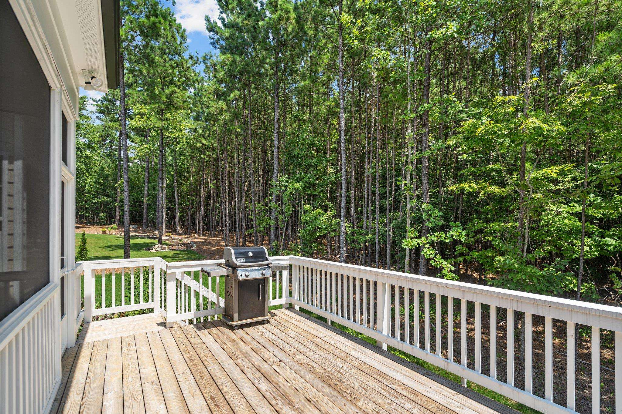 116 Brandy Mill Pittsboro, NC 27312 - Photo 35 of 47 a view of a deck with two chairs and a yard