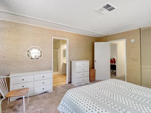 a bathroom with a sink a mirror and a shower