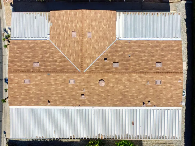 an aerial view of residential houses with outdoor space