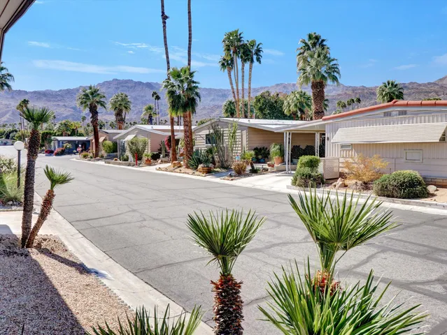 a view of a chairs and table in patio